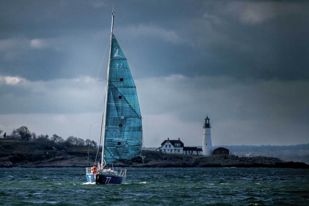 A sailboat sailing in stormy skies