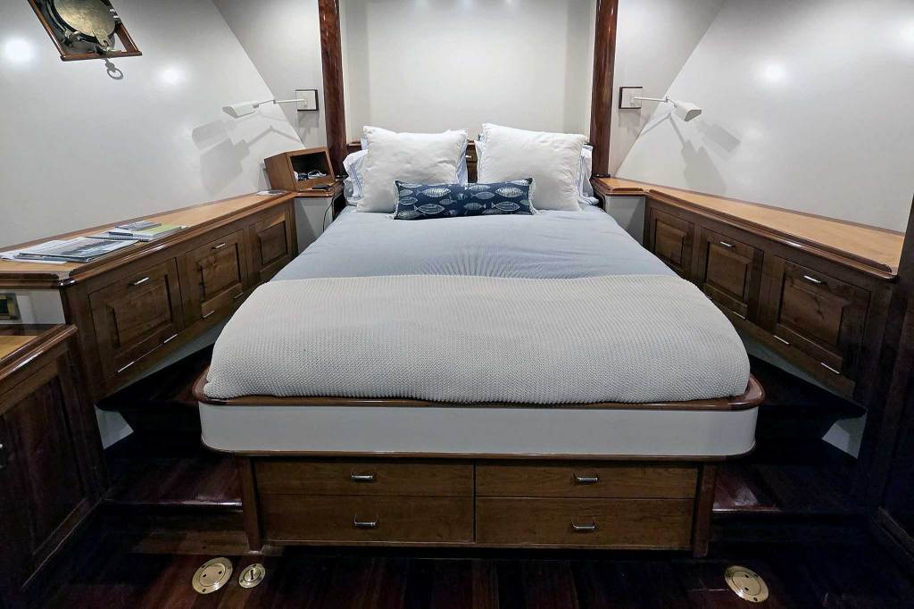 The forward stateroom has classic details, including varnished wood.