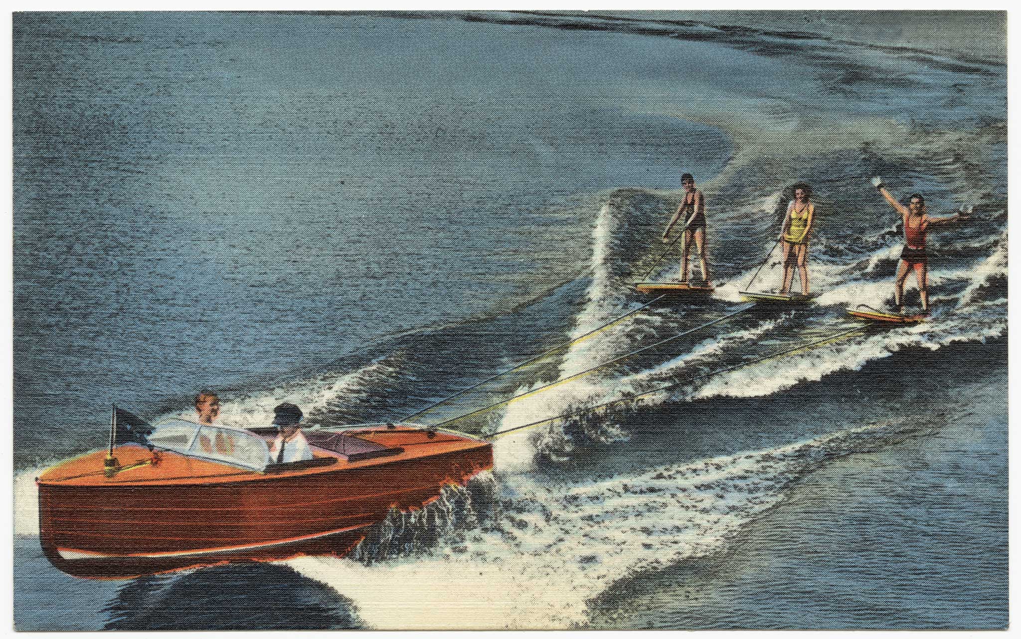 A vintage image of a wooden boat with two people in it with three people water skiing from behind it