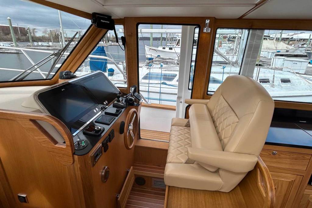 An interior view of the seating of a boat, sideview.