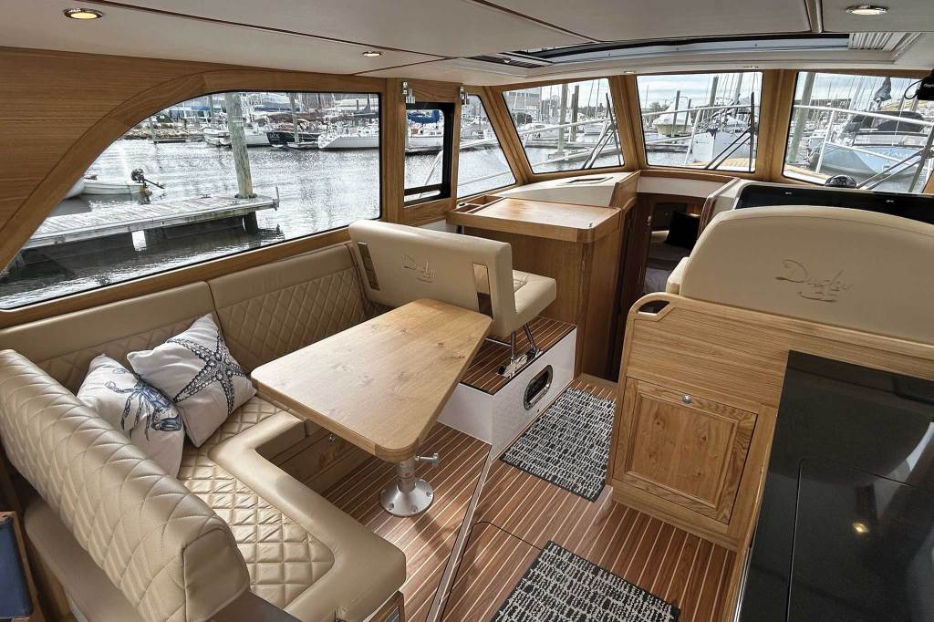The front interior of a boat with seating