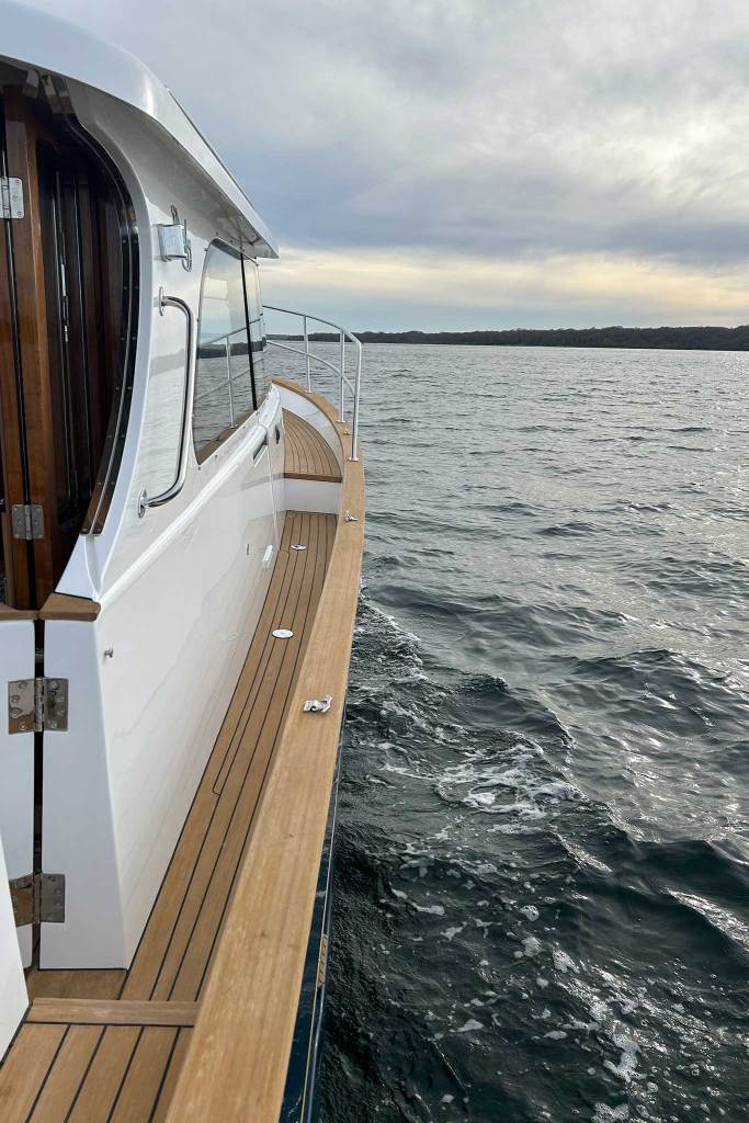 the sidedeck of a boat in the water