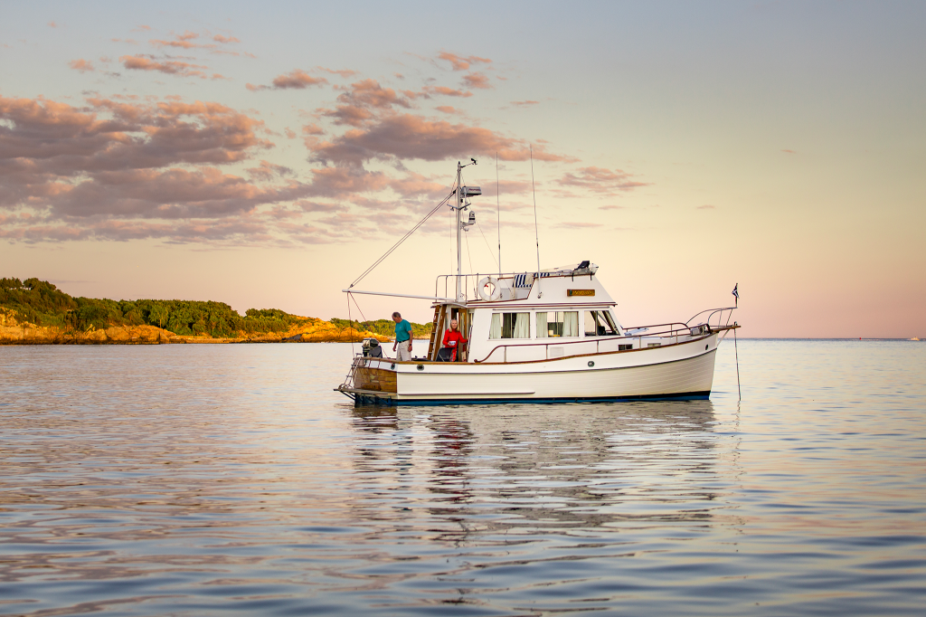 A motorboat at sunset on the water