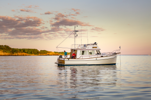 A motorboat at sunset on the water