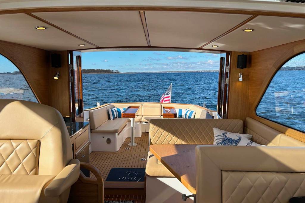 The rear view of the interior of a boat looking out at the stern