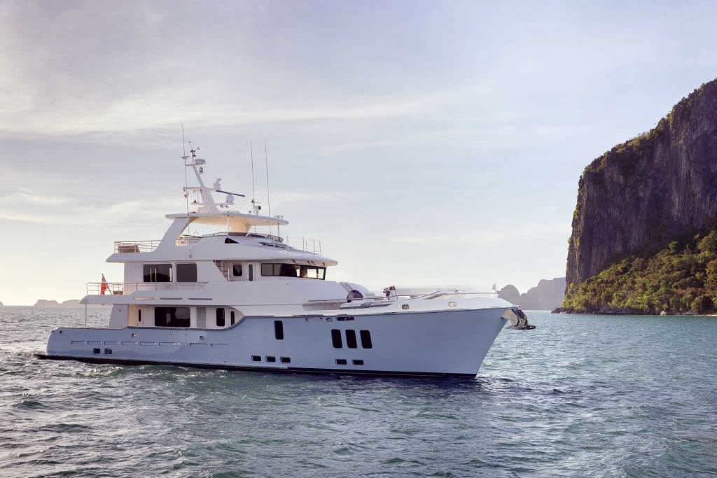 white motor boat out on the water