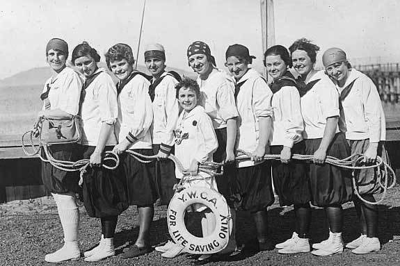 Black and white photo of a group of women on the waterfront