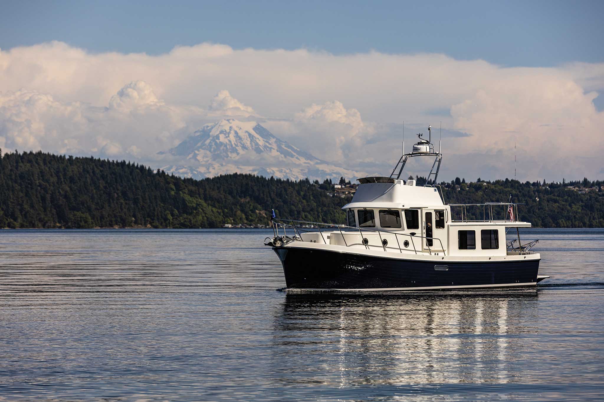 Tug boat surrounded by mountains