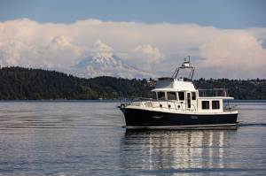 Tug boat surrounded by mountains